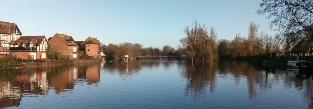 Looking downstream on the Thames in Windsor, Bershire, towards Romney Island on a bright winter morning