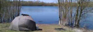 A view across a fishing lake in north Chertsey on a bright spring day