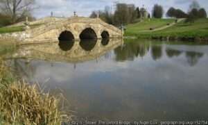 Looking across the Oxford Water angling venue at Stowe Estate on a sunny day