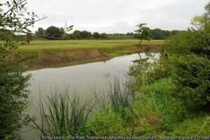 The River Thame at Wheatley under a cloudy summer day